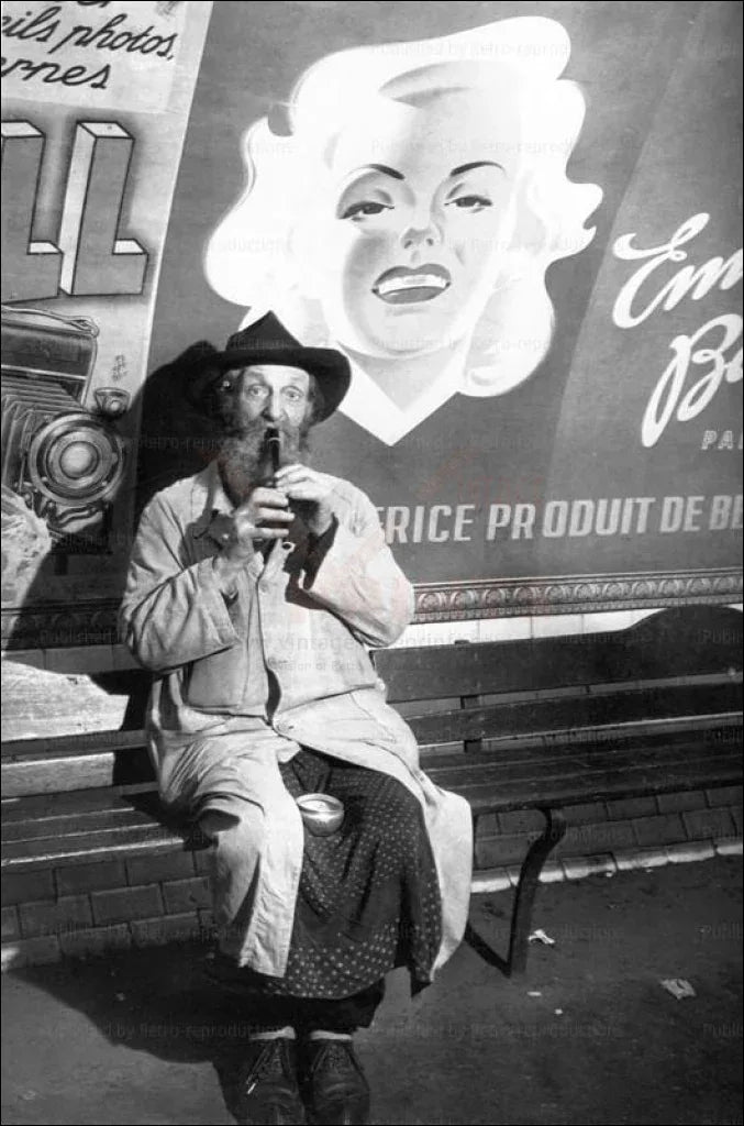 Homeless man playing music in the French Metro - VINTAGEARTREPRINTS.COM