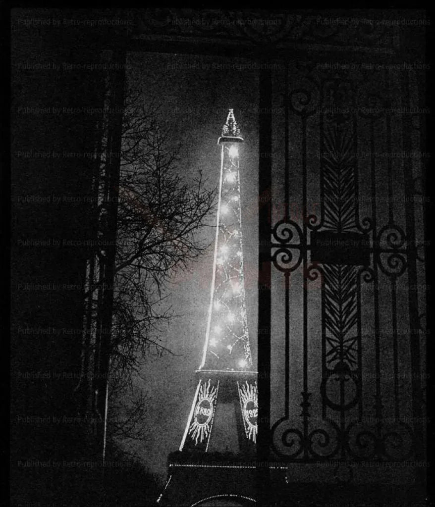 The Eiffel Tower at Night - VINTAGEARTREPRINTS.COM