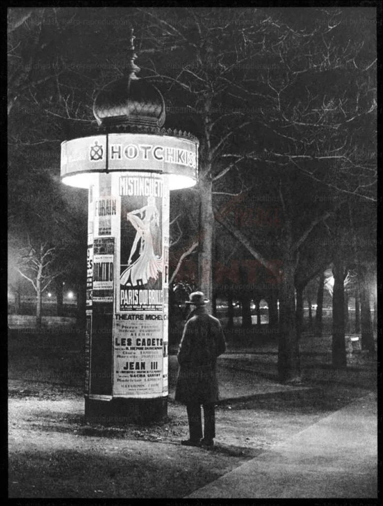 Paris by Night Man studying a kiosk - VINTAGEARTREPRINTS.COM